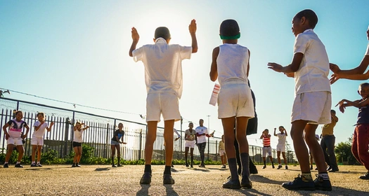 Kids playing outside at school in South Africa Image of Kids playing outside at school in South Africa addressing heart health in schools